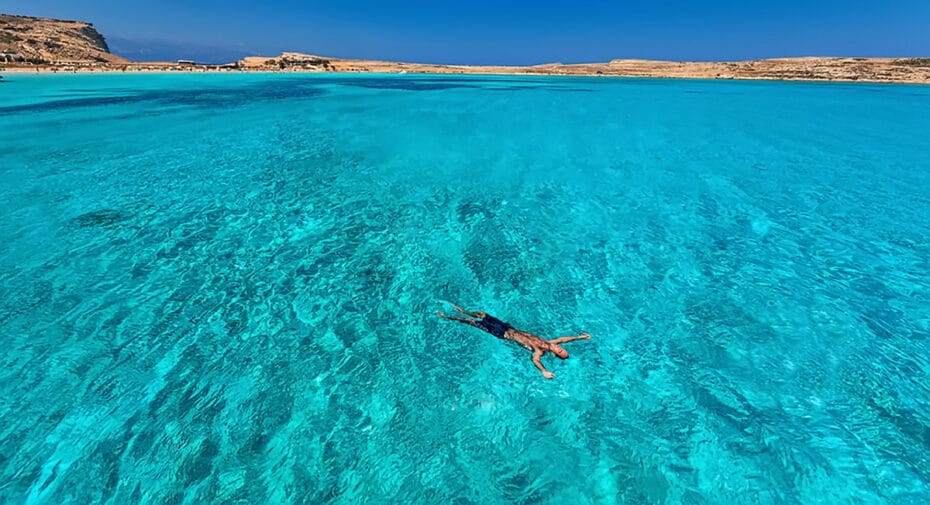 thalassa-blue-man-floating-in-azure-sea-greece Man swimming in azure waters in Greece