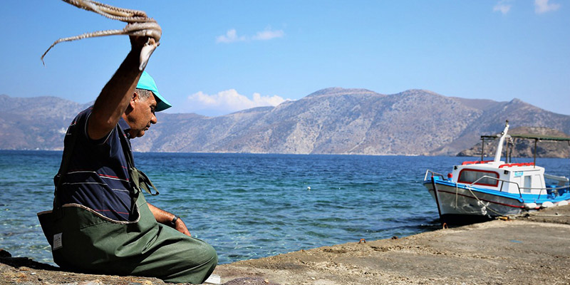 Magic of the Cyclades-Greek fisherman with octopus